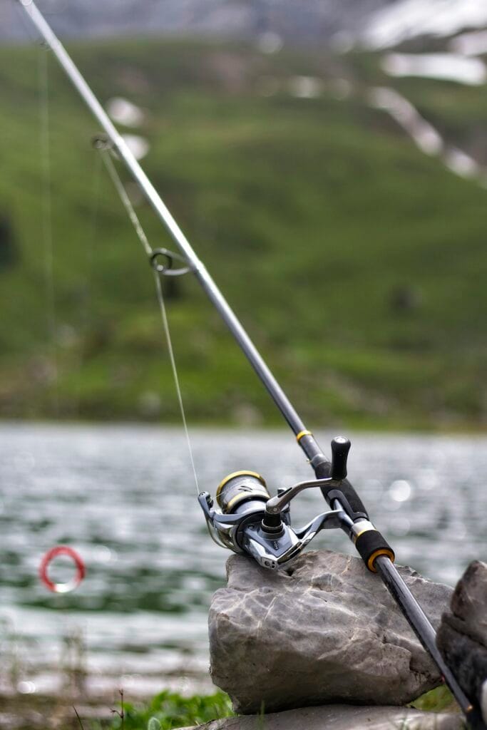 Angler sight fishing for bedding bass in shallow clear water