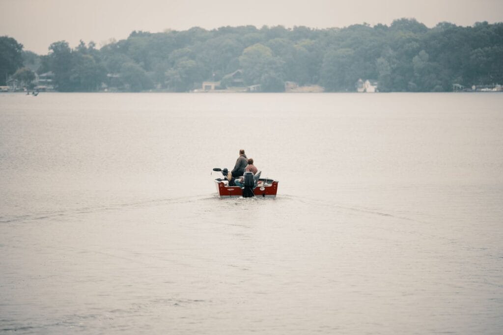 Anglers fishing a lake on a summer day