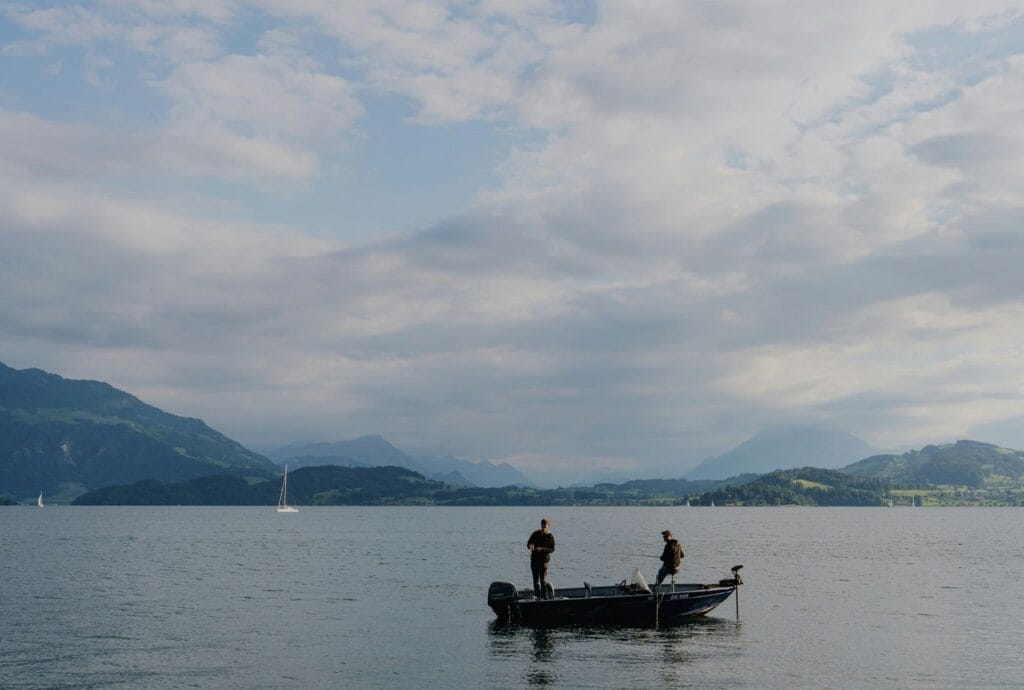 Anglers fishing a calm lake